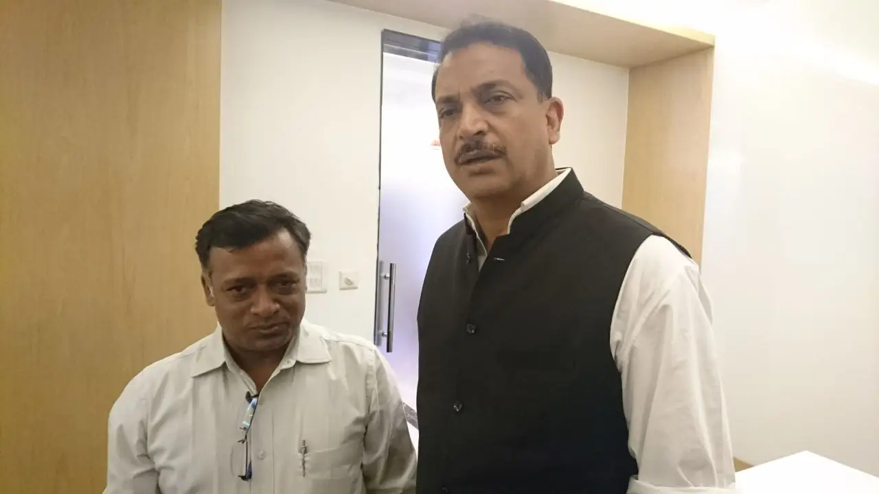 Two men standing in an office